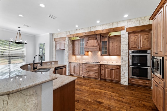 kitchen featuring appliances with stainless steel finishes, sink, crown molding, dark hardwood / wood-style flooring, and custom range hood