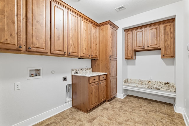 laundry area featuring hookup for a washing machine, cabinets, light tile patterned floors, electric dryer hookup, and gas dryer hookup