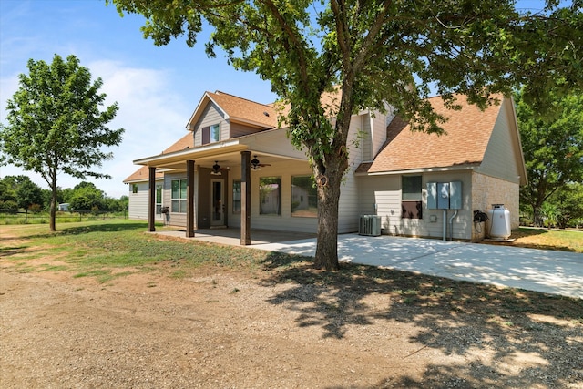 view of front of house with central air condition unit and ceiling fan