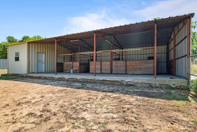 view of stable with an outbuilding