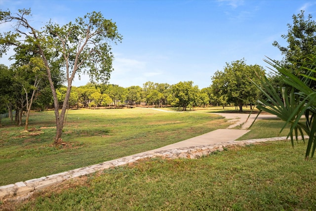 view of home's community featuring a lawn