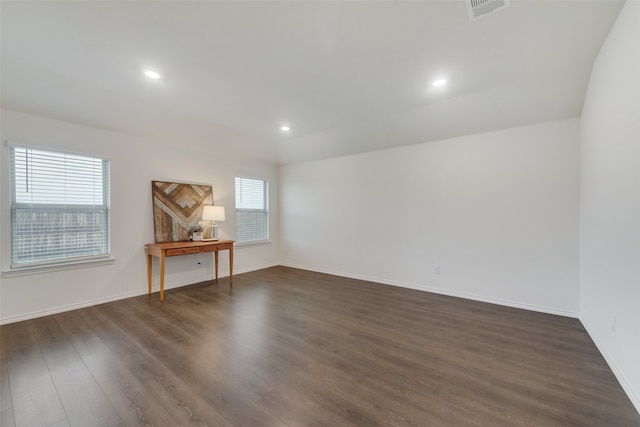 unfurnished room featuring dark hardwood / wood-style flooring