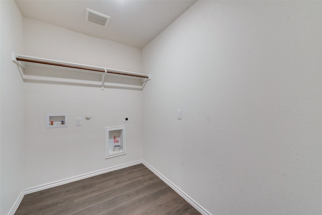 clothes washing area with hookup for a washing machine, hardwood / wood-style flooring, electric dryer hookup, and hookup for a gas dryer