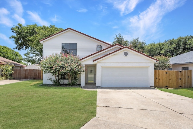 view of front of house with a garage and a front lawn