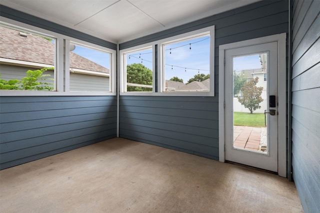 unfurnished sunroom featuring a healthy amount of sunlight