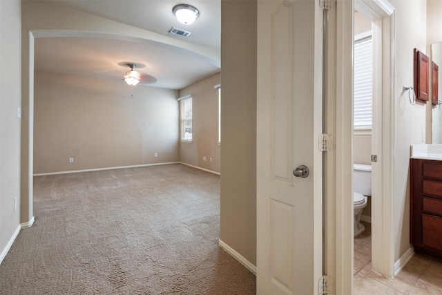 interior space featuring light colored carpet