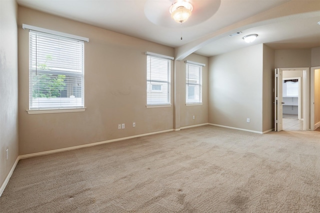 carpeted empty room with ceiling fan