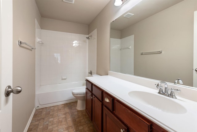 full bathroom with vanity, toilet, and tiled shower / bath combo