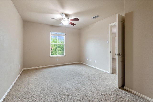 carpeted empty room with ceiling fan