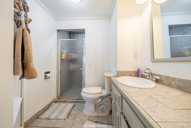 bathroom with crown molding, vanity, and a shower with shower door