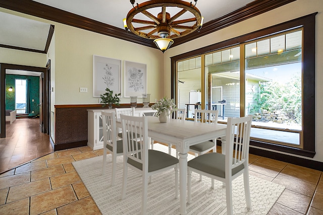 dining space with ornamental molding