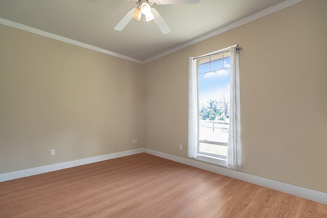 unfurnished room featuring ceiling fan, baseboards, light wood-type flooring, and ornamental molding