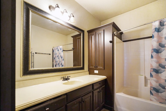 bathroom with shower / bath combo with shower curtain and vanity