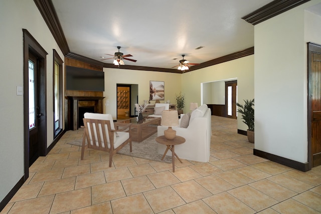 living room featuring ceiling fan, light tile patterned floors, and crown molding