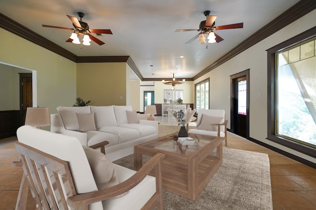 living room with light tile patterned floors, ceiling fan with notable chandelier, and ornamental molding