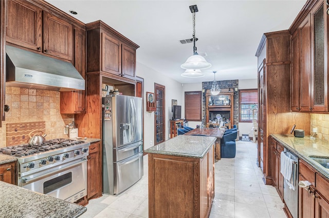 kitchen with decorative backsplash, stainless steel appliances, light tile patterned floors, and pendant lighting