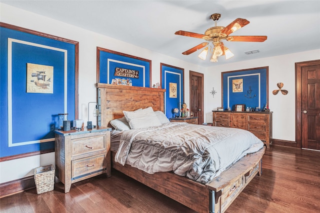 bedroom featuring dark hardwood / wood-style flooring and ceiling fan