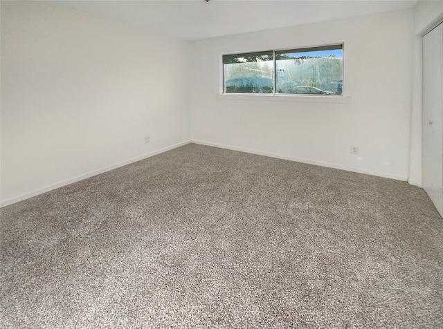 empty room featuring carpet floors