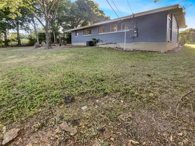 rear view of house with a lawn