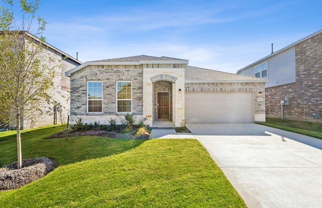 view of front of property with a garage and a front yard