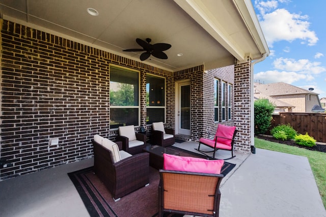 view of patio / terrace with ceiling fan and an outdoor living space