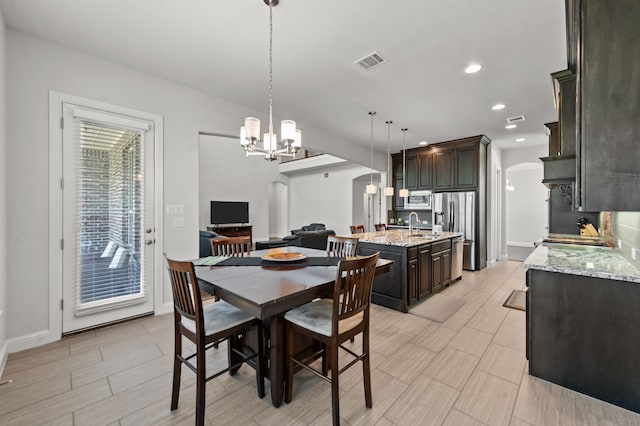 dining space with a chandelier