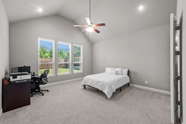 bedroom with ceiling fan, lofted ceiling, and light carpet