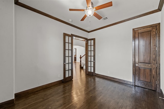 spare room with ceiling fan, ornamental molding, dark hardwood / wood-style flooring, and french doors