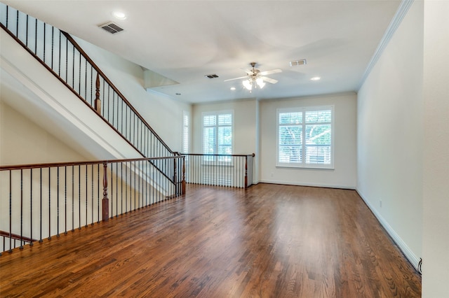 spare room with ornamental molding, ceiling fan, and dark hardwood / wood-style flooring