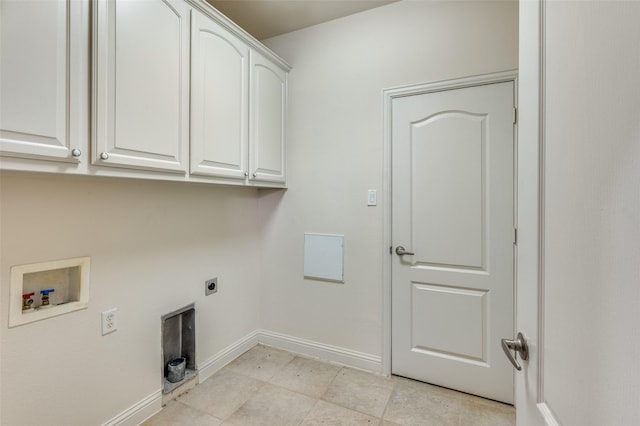 clothes washing area featuring cabinets, hookup for an electric dryer, and washer hookup