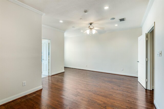 empty room with ceiling fan, dark wood-type flooring, and crown molding