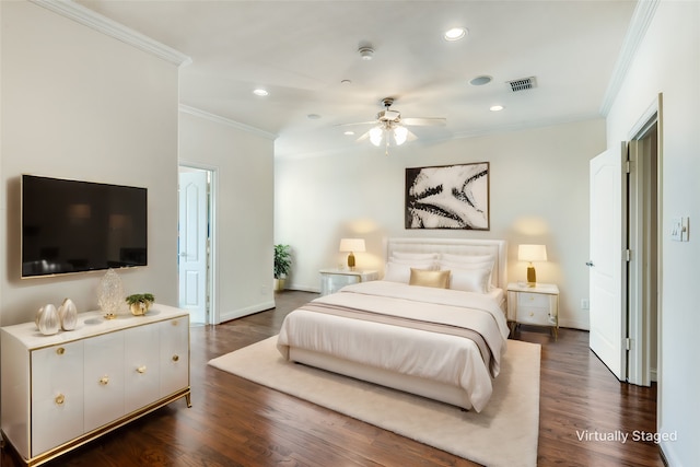 bedroom with crown molding and dark hardwood / wood-style floors