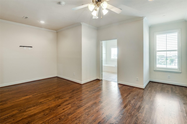 unfurnished room featuring dark wood-type flooring, ornamental molding, and ceiling fan