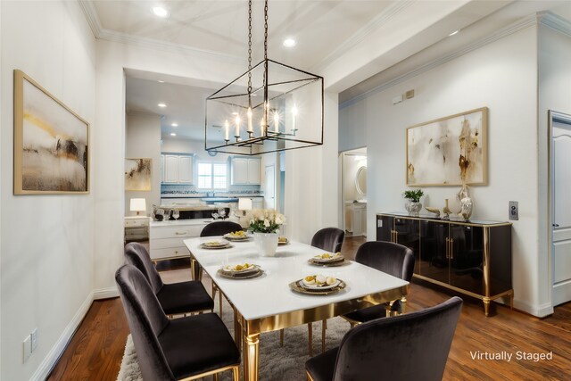 dining space with a notable chandelier, crown molding, and dark hardwood / wood-style floors