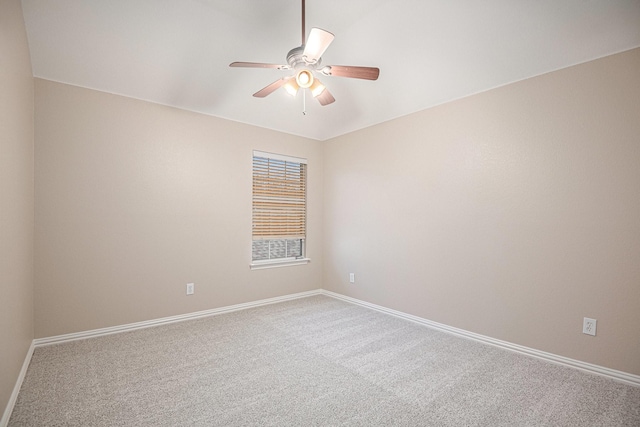 spare room with carpet flooring and ceiling fan