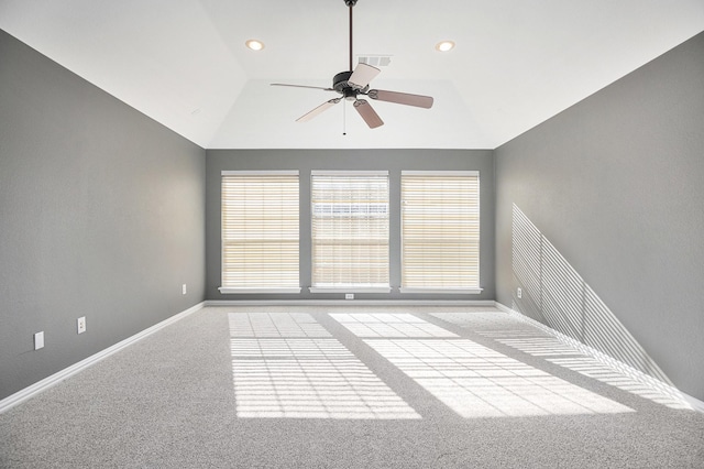 unfurnished room featuring ceiling fan, light colored carpet, and lofted ceiling