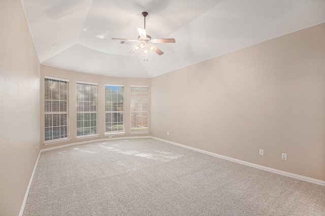 unfurnished room featuring carpet floors, vaulted ceiling, and ceiling fan