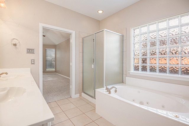 bathroom with tile patterned floors, vanity, and plus walk in shower