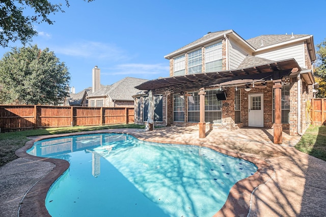 view of pool with a patio and ceiling fan