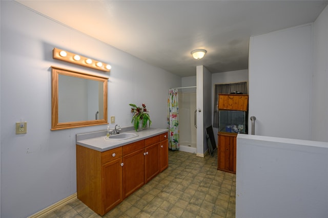 bathroom with vanity, walk in shower, and tile patterned flooring