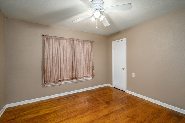 unfurnished room featuring ceiling fan and wood-type flooring