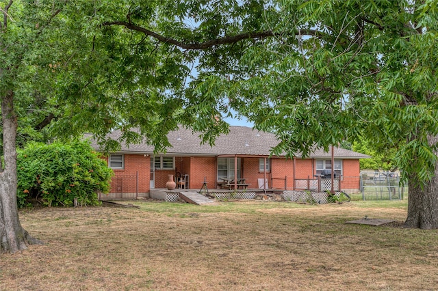 back of house with a yard