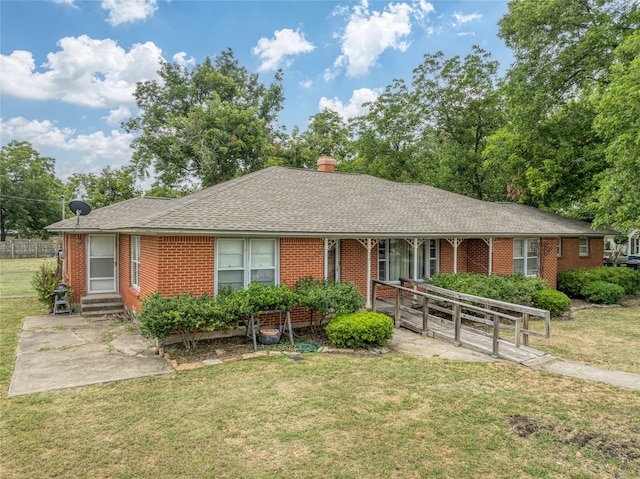 single story home with a front yard