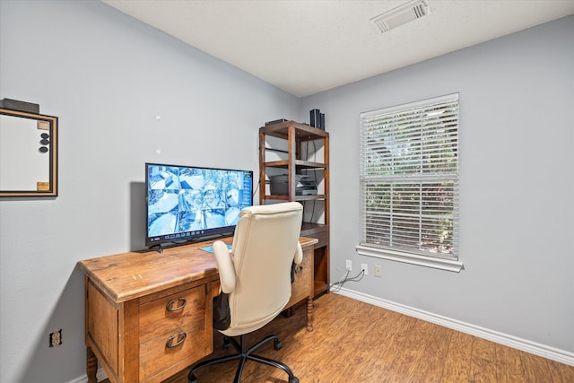 home office with light wood-type flooring