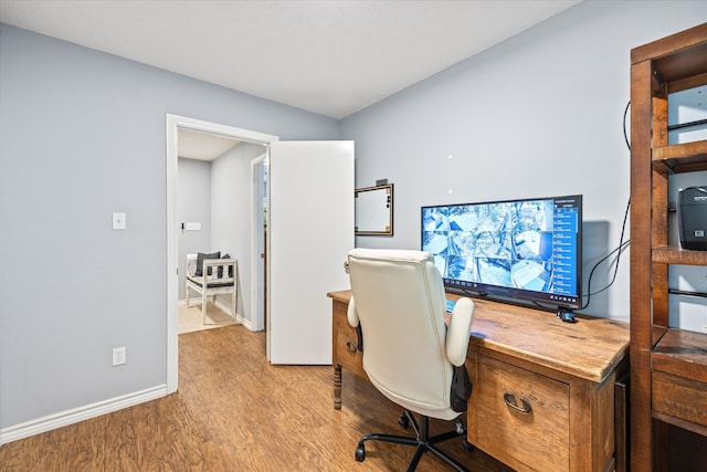 office with hardwood / wood-style flooring