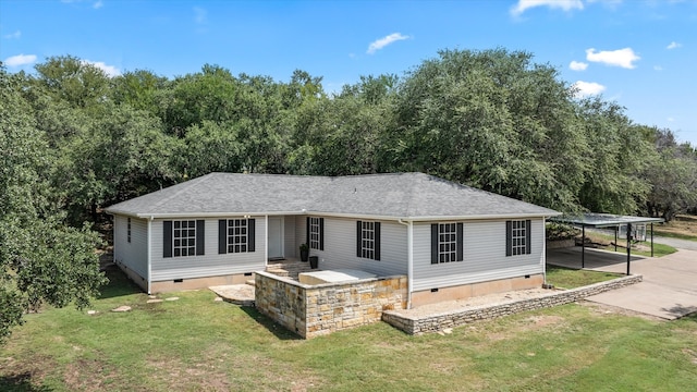 view of front facade featuring a front lawn and a carport