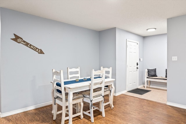 dining space featuring hardwood / wood-style floors