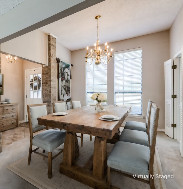 dining space with a chandelier