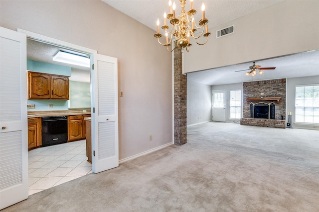 unfurnished living room featuring light carpet, a fireplace, and a healthy amount of sunlight