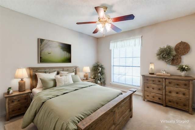 carpeted bedroom featuring ceiling fan